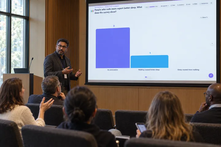 Illustration of a conference presenter discussing an edauthor poll about interpreting a survey with an attentive audience.